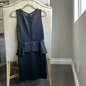 GUESS fitted peplum cocktail dress. Full mesh back & sexy mesh detail on front.